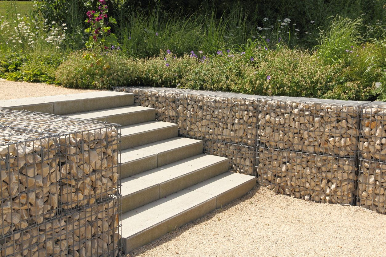 Gabion Retaining Wall Beside Backyard Staircase. Types Of Retaining ... with Elevate Your Outdoor Space with the Unexpected Beauty of Gabion Walls