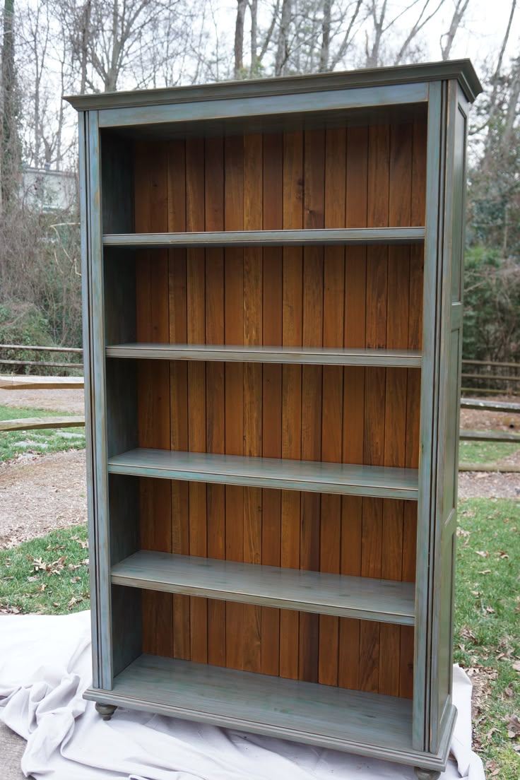 Custom Bookcase With Blue Hand-Painted Finish And Stained Plank Back ... for Making a Statement with Custom Shelf Back Panel Concepts
