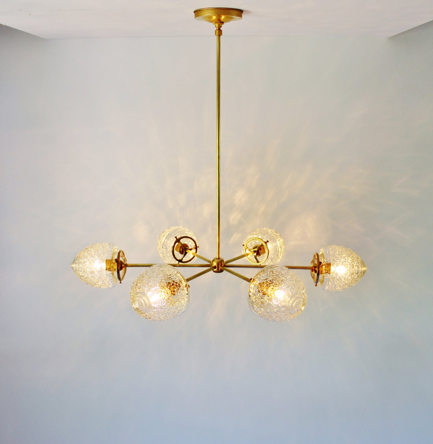 Modern Brass Chandelier With Clear Glass Acorn Shades 6 throughout 7-Light Brass Chandelier With Clear Rippled Glass