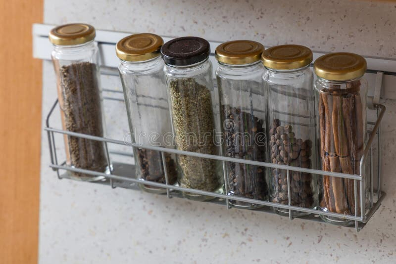 Spices In Jars Stored On A Shelf In The Kitchen Stock Image - Image Of ... regarding How to maximize your cooking space with smart spice jar storage