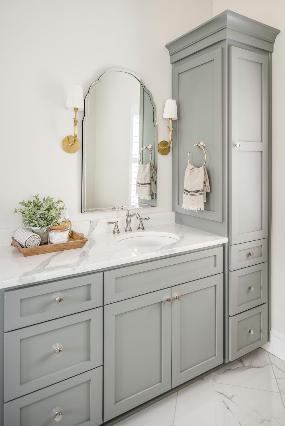 A Bathroom With Gray Cabinets And White Marble Counter Tops, Gold ... within Milwaukee Bathroom Cabinet Light Gray
