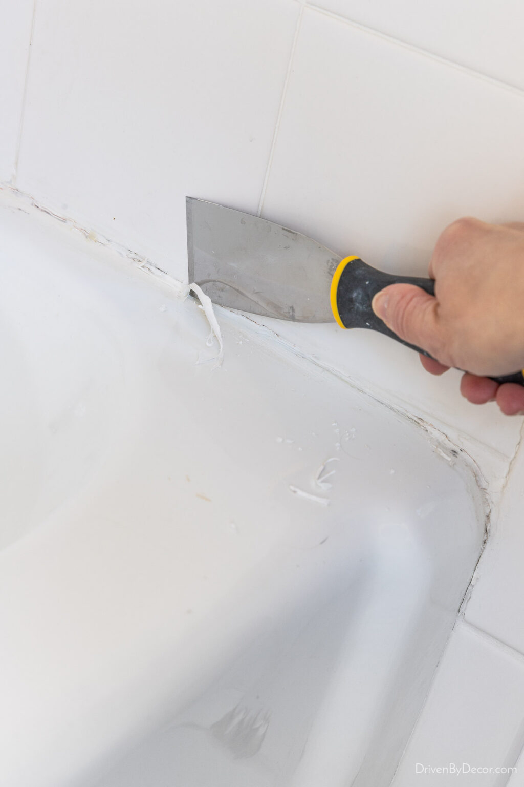 How To Caulk A Bathtub Like A Pro! - Driven By Decor for How To Remove And Replace Bathtub Caulk