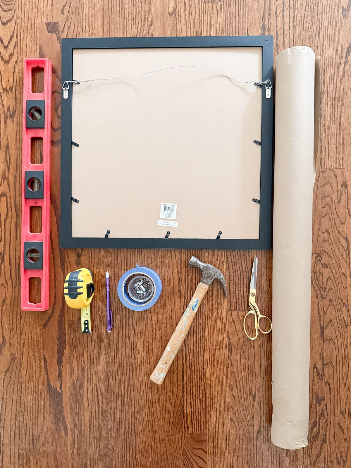 How To Hang A Gallery Wall The Easy Way (Without Extra Nail Holes) for How To Hang A Gallery Wall