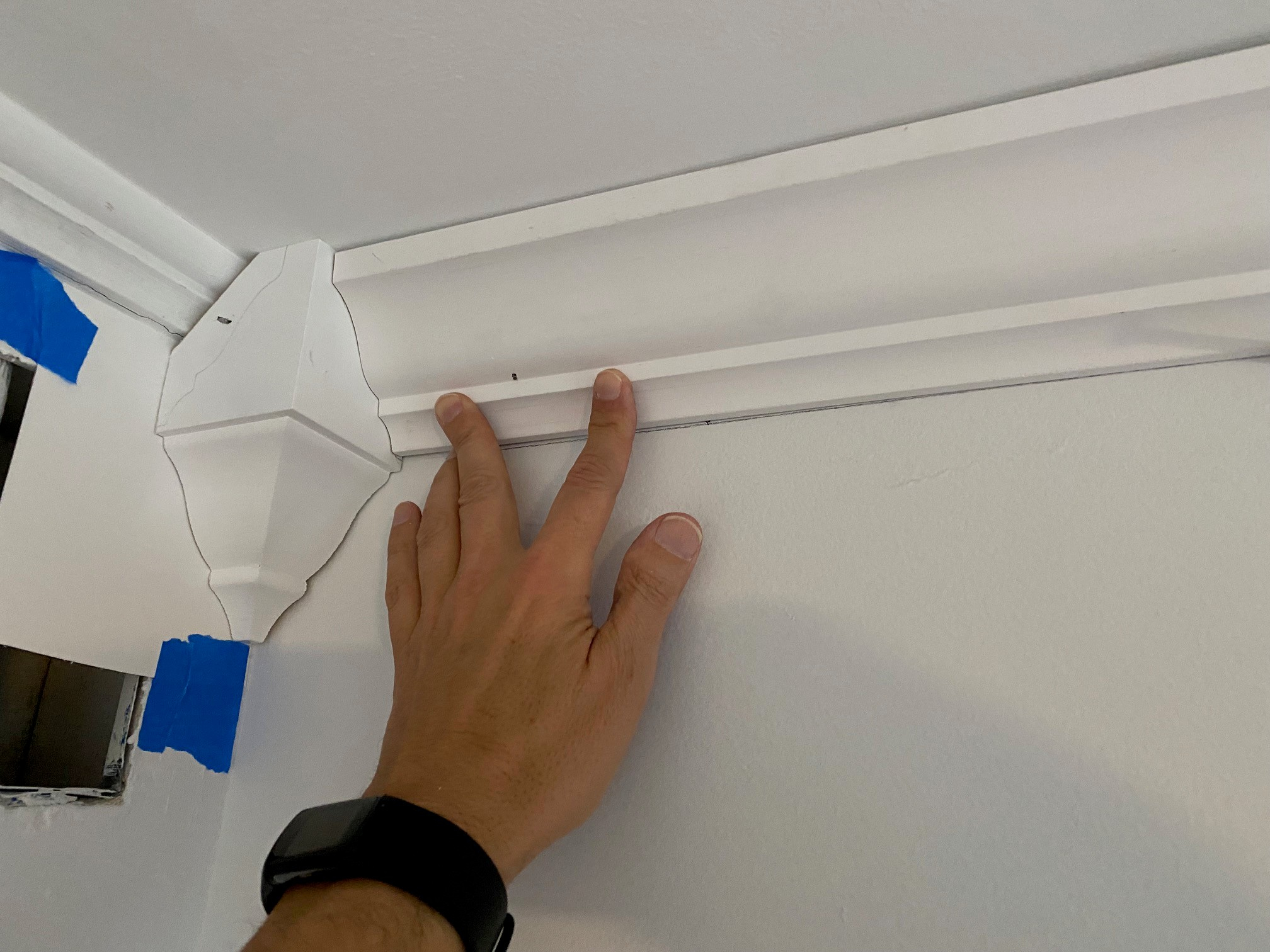 How to Install Crown Molding: Nestle It, Cope the Corners, and Nail It Up Right